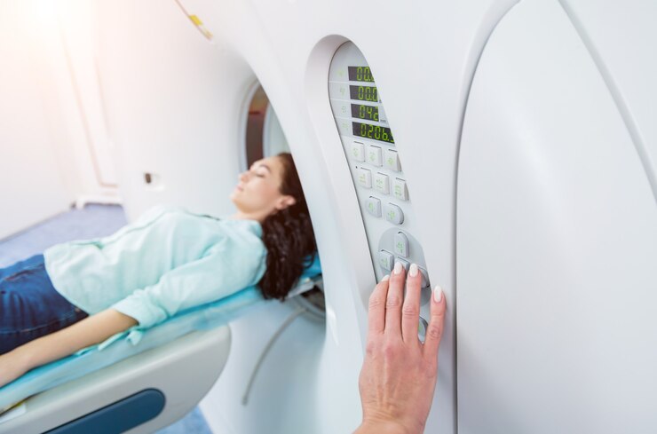 Photo doctor and patient in room of computed tomography at hospital.