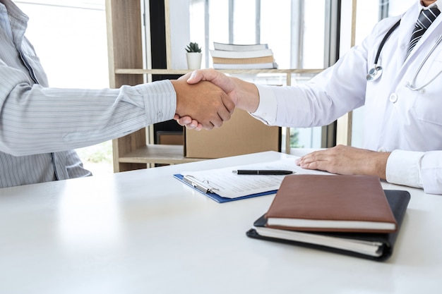 Doctor and patient shaking hands