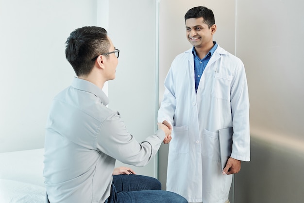 Doctor and patient shaking hands