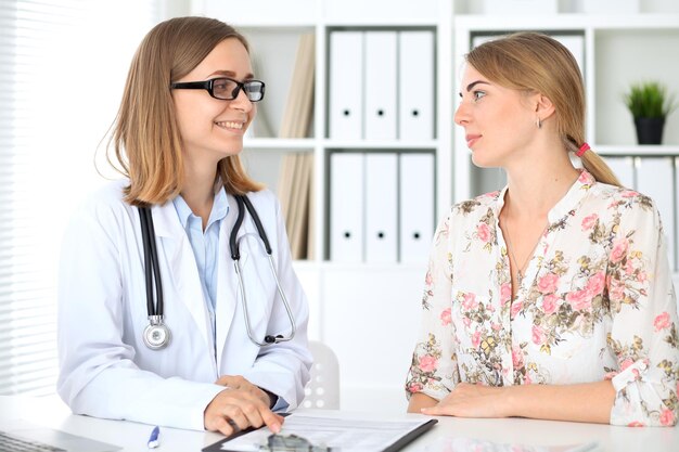 Doctor and patient sitting at the desk