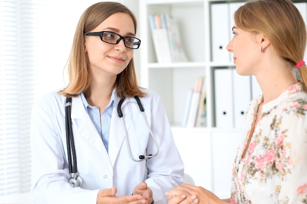 Doctor and patient sitting at the desk