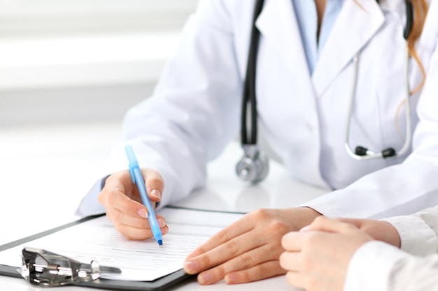 Doctor and patient sitting at the desk