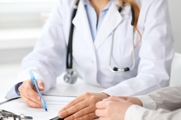 Doctor and patient sitting at the desk