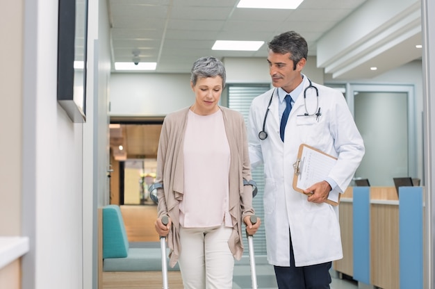 Doctor and patient with crutches