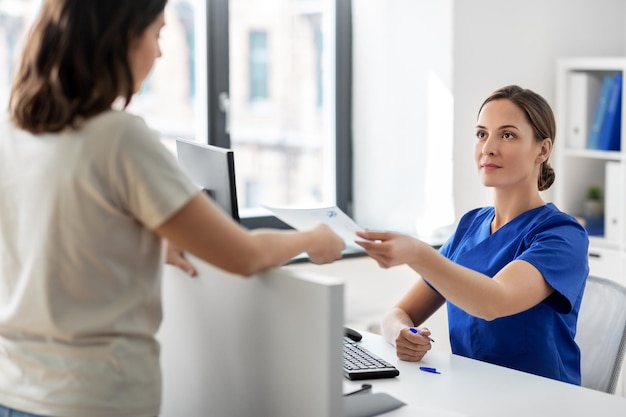 doctor and patient with prescription at hospital
