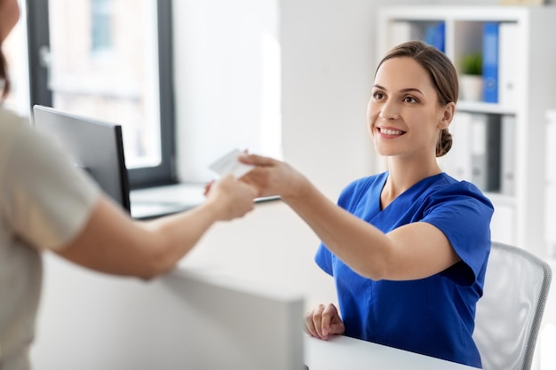 doctor and patient with prescription at hospital