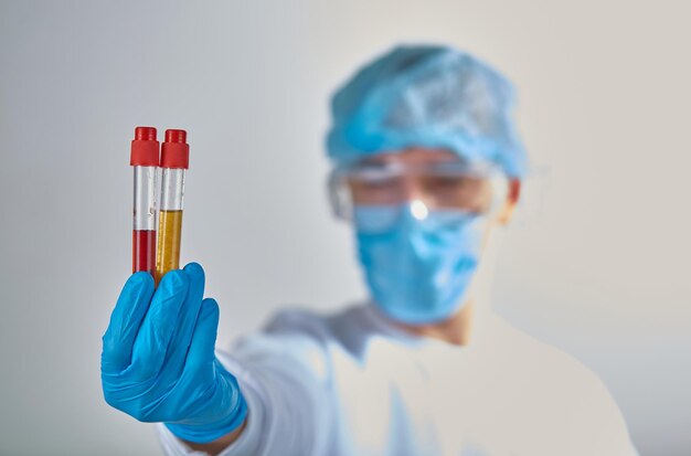 doctor performing blood test for coronavirus covid19 hiv ebola or any other infection