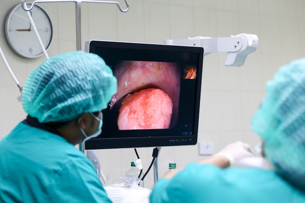 Doctor performing colonoscopy in Operating Room