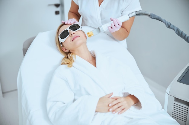 Doctor performing the laser skin tightening treatment