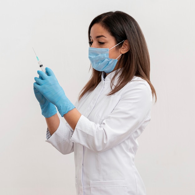 Doctor preparing medical vaccine