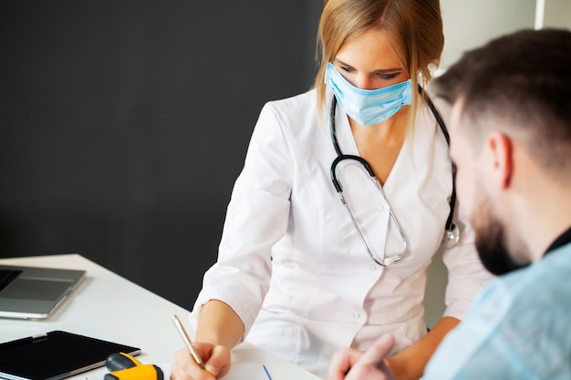 Doctor in protective mask working at the hospital