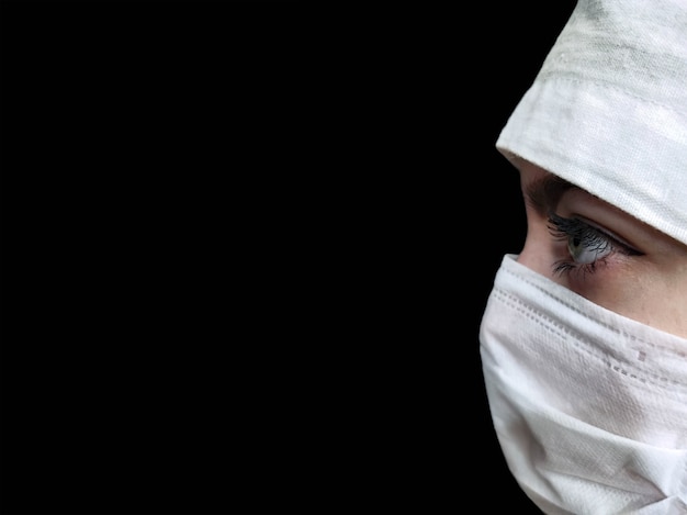 Doctor in protective medical mask and medical cap