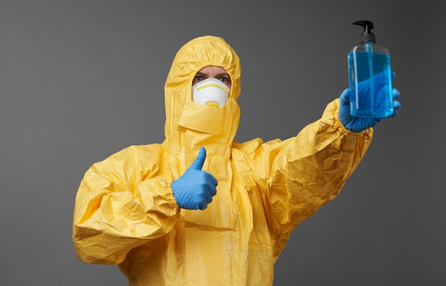 Doctor in a protective suit with medical mask and protective gloves