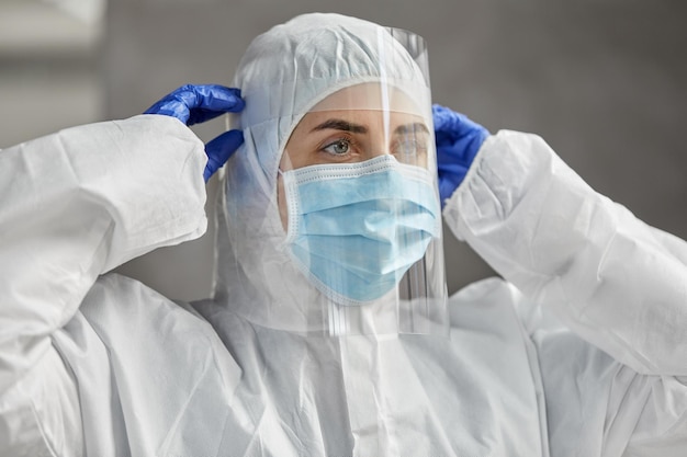 doctor in protective wear mask and face shield