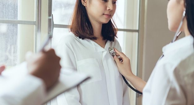 The doctor provides consultation with the patient and records the treatment history 