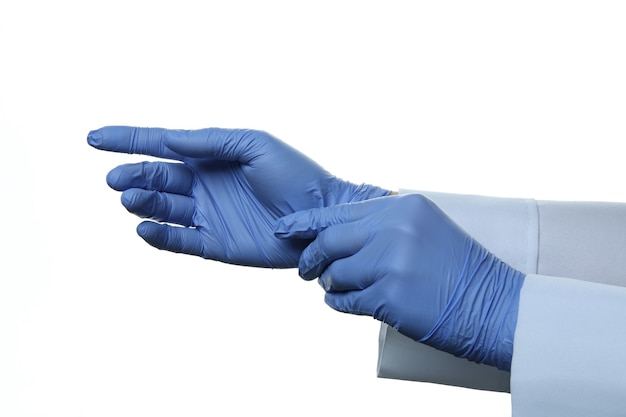 Photo doctor puts medical gloves, isolated on white