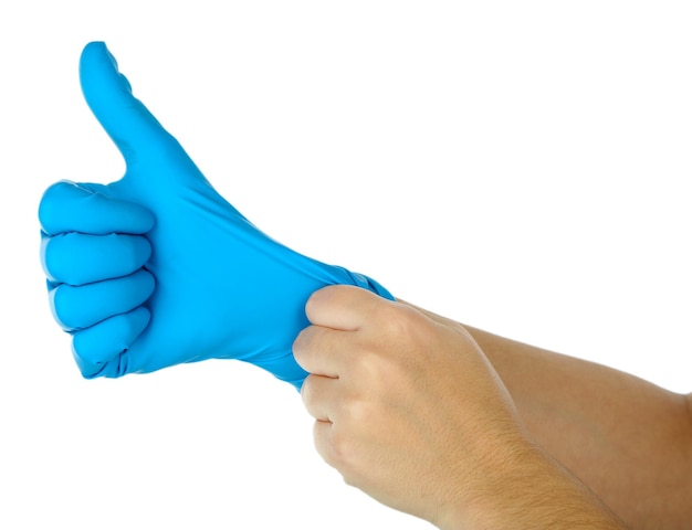 Doctor putting on protective gloves isolated on white