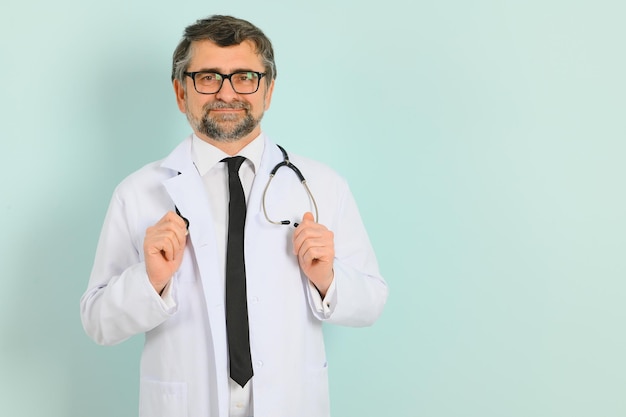 Doctor ready to help patients with health problems isolated on blue background with copy space