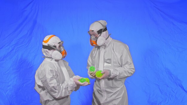 Doctor in respirator show a virus model concept health safety protection coronavirus epidemic