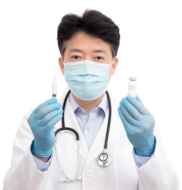 The doctor's hand wearing blue gloves against white background and holding Covid-19 vaccine.