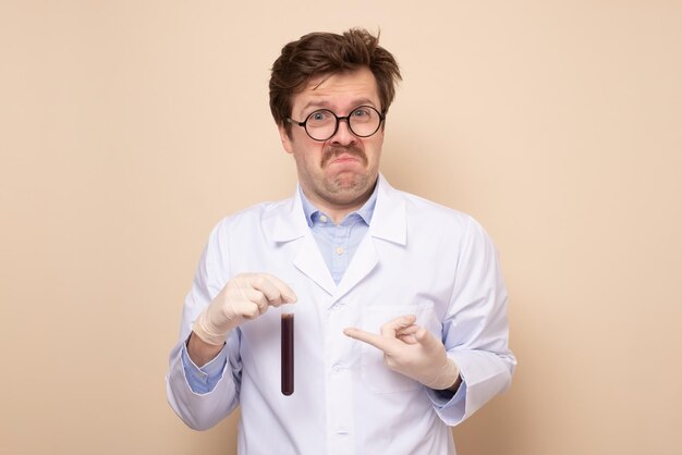 Doctor scientific research assistant in a medical coat holding tube with liquid