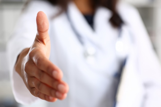 Doctor shake hand as hello with patient