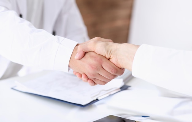 Doctor shake hand as hello with patient