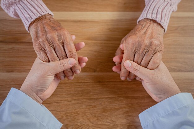 The doctor shook the patients hand as a sign of encouragement