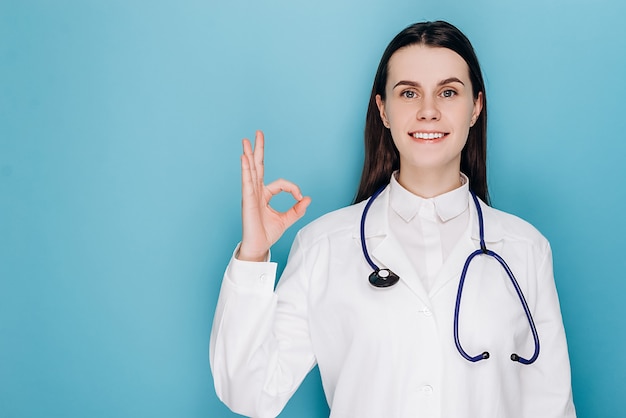 Doctor show okay gesture, smiling at camera with optimistic