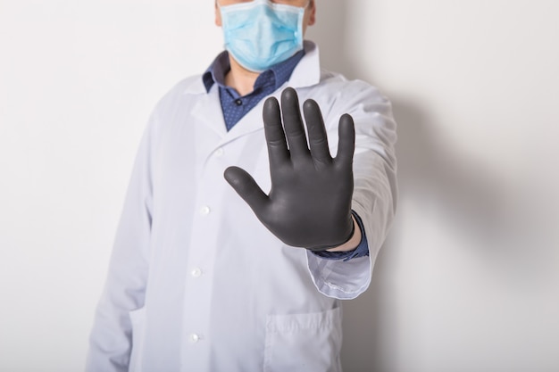 doctor show stop hand gesture to stop virus