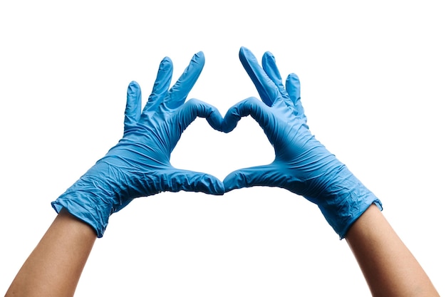 Doctor showing heart gesture in latex gloves