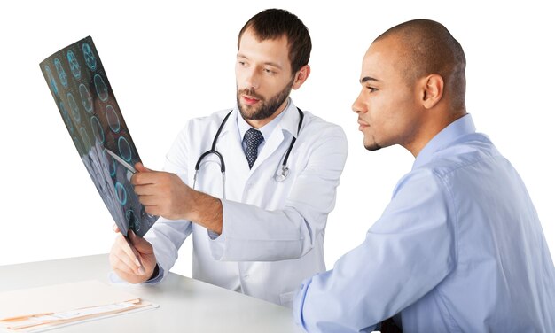 Doctor showing x-ray to patient isolated on white background