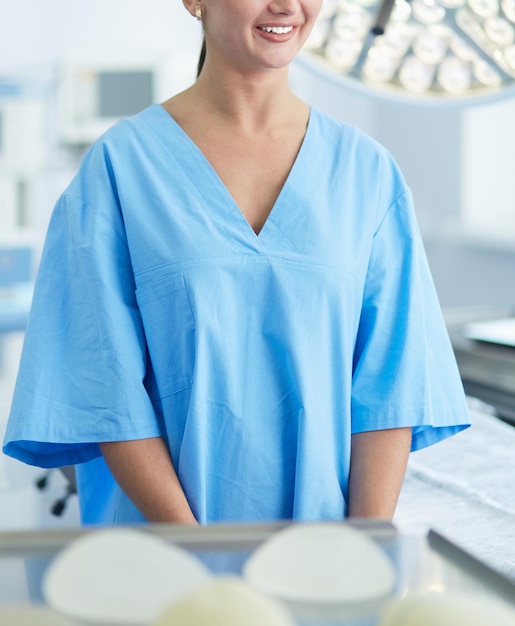 Doctor showing young patient her chest in his office at the hospital