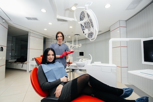 The doctor shows a cast of the patient's jaw. Dentistry