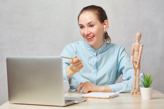 Doctor smiling speaking via video chat with someone