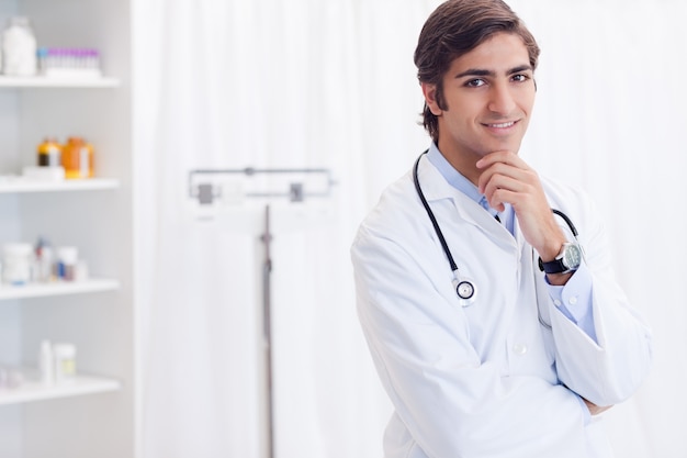 Doctor standing in his examination room