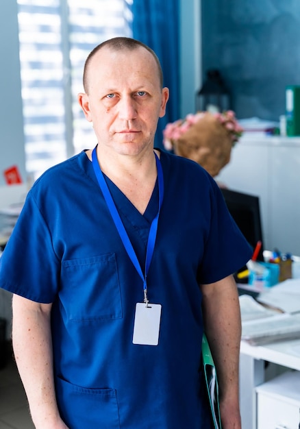 Doctor standing in office Medical male portrait Medical concept Vertical photo