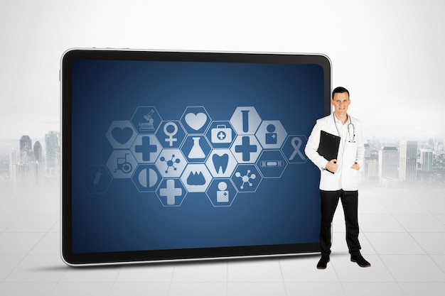 Doctor standing with digital tablet in the hospital