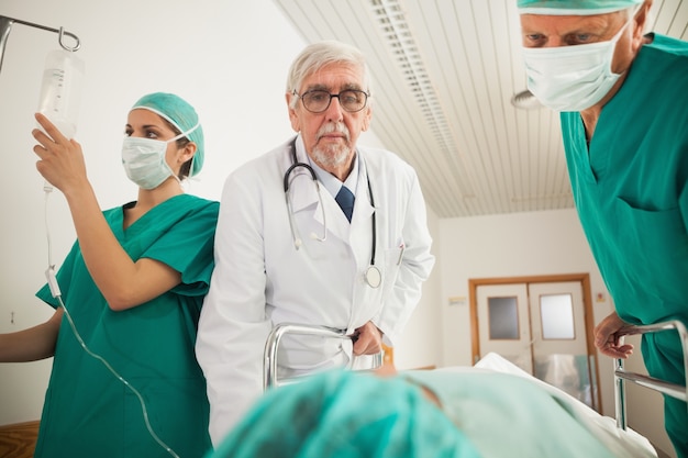 Doctor and surgeon looking at a patient