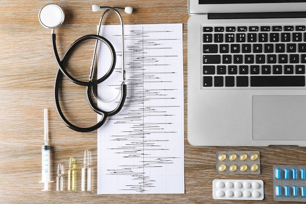 Doctor table with medical items Flat lay