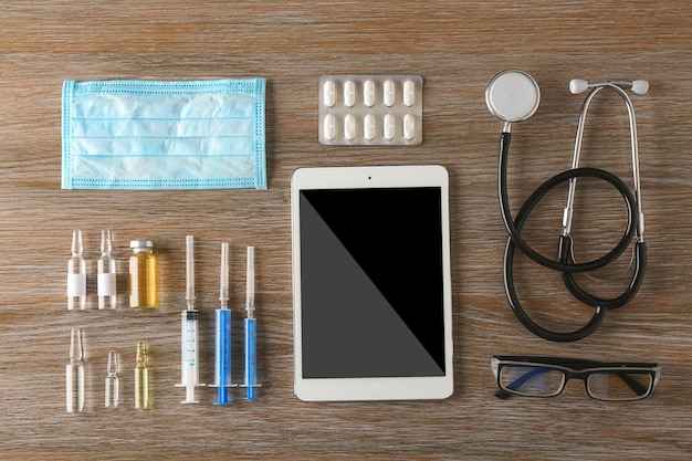 Doctor table with medical items Flat lay