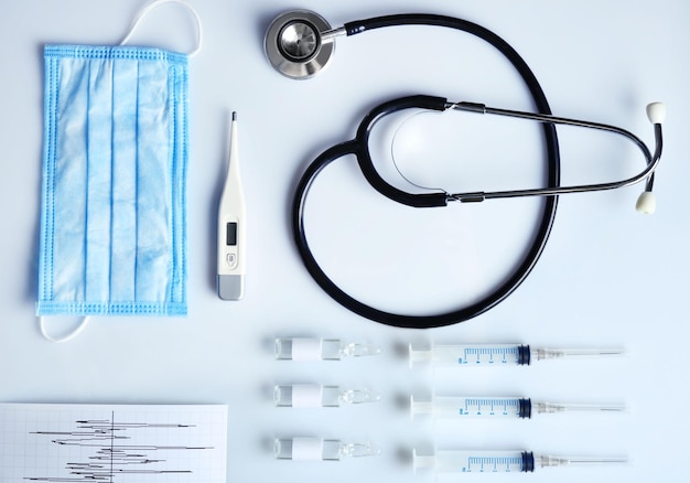 Doctor table with medical items top view