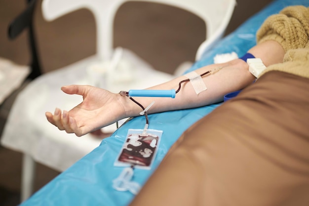 The doctor takes blood from the patient. Blood donation. Donation