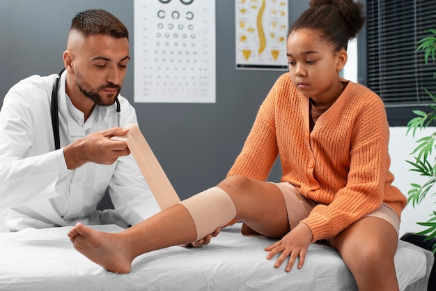 Doctor taking care of afro-american child