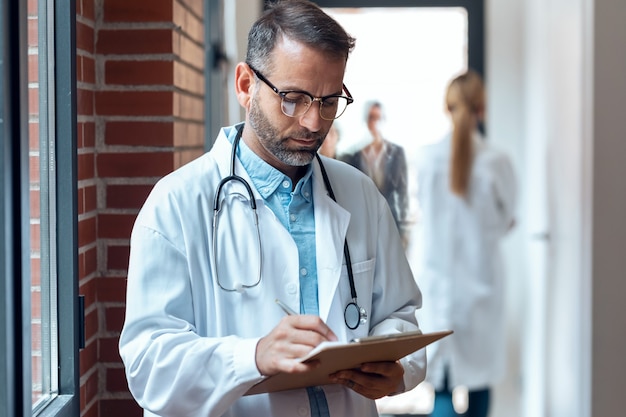 Doctor taking notes in hospital