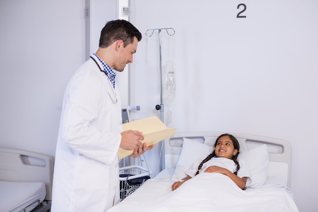 Doctor talking to a girl patient