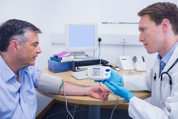 Doctor talking to his patient about his blood pressure