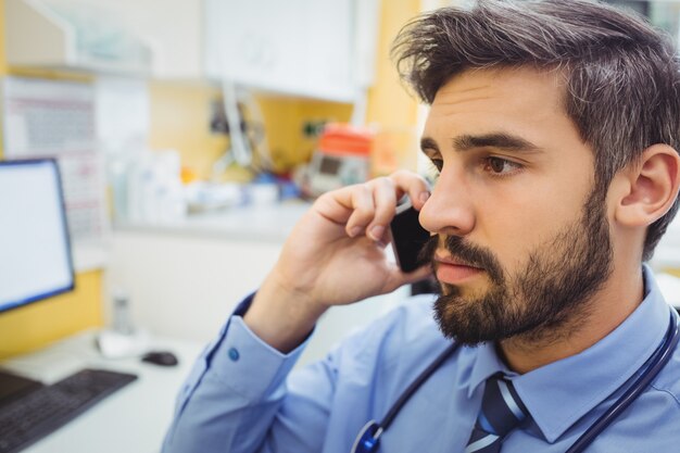 Doctor talking on mobile phone