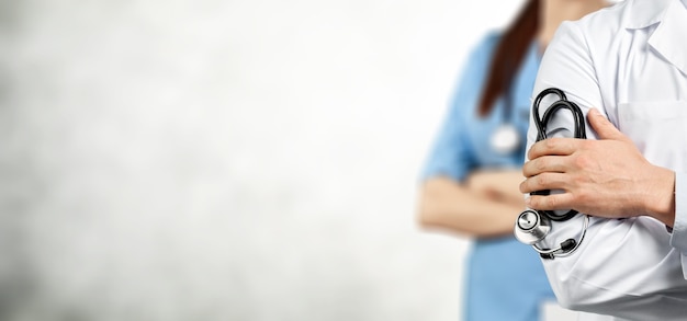 doctor team with medical stethoscope on background
