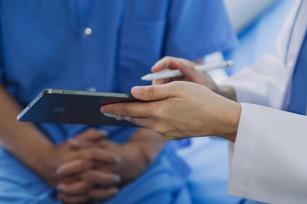 Doctor telling to patient woman the results of her medical tests Doctor showing medical records to cancer patient in hospital ward Senior doctor explaint the side effects of the intervention